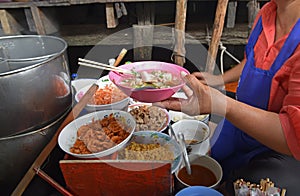 Boat noodle is a Thai style noodle dish originally served from boats that traversed Bangkok's canals photo