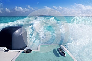 Boat outboard stern with prop wash caribbean foam