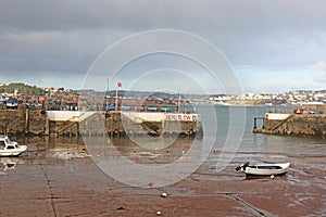 Boat in Paignton harbour, Devon, at low tide