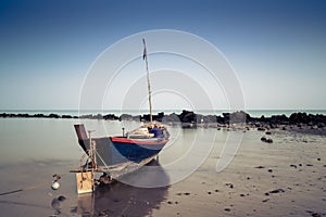 A boat at Pala beach when sunset