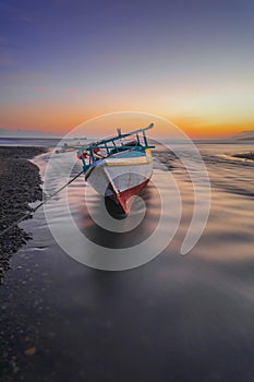 The boat parked at dusk