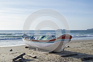 Boat parked at the Ingleses beach in Florianopolis, Brazil during the sunrise
