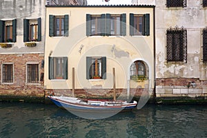 Boat parking in front of old facade building