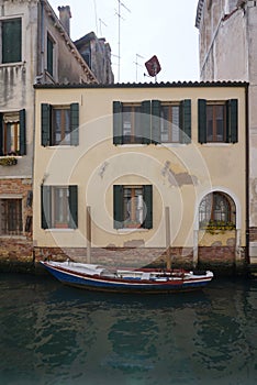 Boat parking in front of old facade building