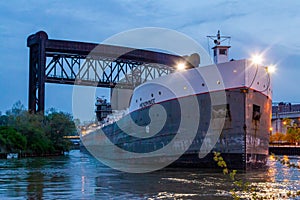 Boat passing under drawbridge in Cleveland photo