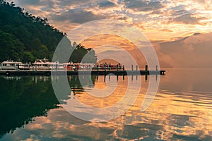 Boat pier on Sun Moon Lake with beautiful sky with water reflection