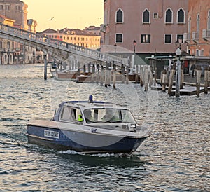 Boat of police into grand canal in venice