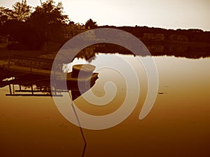 Boat and Pond at Sunset in Sepia