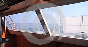 Boat porthole sailboat view blue ocean sea sky horizon