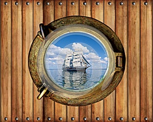 Boat porthole window ship with ocean view and wood background