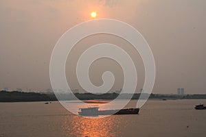 A Boat in the Red River Sunset Hanoi