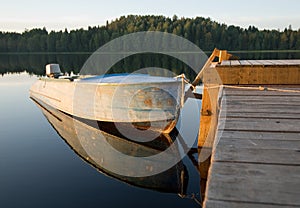 Boat reflecting in calm waters