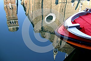 A boat and a reflection