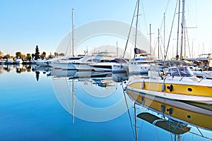 Boat reflections on sea at Alimos marine Greece