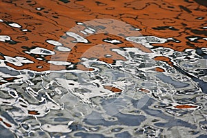 Boat reflections in water