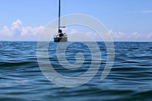 boat rests on the sea on a calm day.