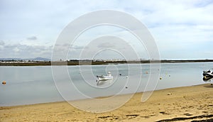 Boat in Ria Formosa with the city of Faro at background. Algarve region, Portugal