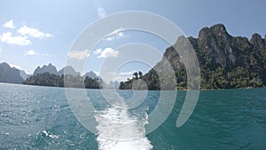 Boat ride , tropical Thai jungle lake Cheo lan, wooden mountains nature, national park ship yacht rocks
