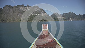 Boat ride , tropical Thai jungle lake Cheo lan, woodrn mountains nature, national park ship yacht rocks