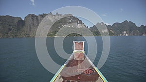 Boat ride , tropical Thai jungle lake Cheo lan, woodrn mountains nature, national park ship yacht rocks