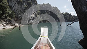 Boat ride , tropical Thai jungle lake Cheo lan, woodrn mountains nature, national park ship yacht rocks