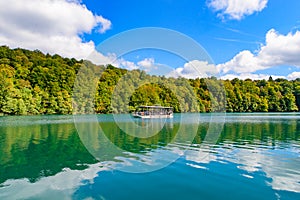 Boat ride on turquoise lake at Plitvice Lakes National Park, Croatia