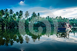 Boat by river bank