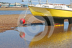 Boat on the River Teign at Shaldon, Devon, at low tide