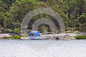 Boat at a rocky beach at a forest photo