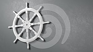 Boat Rudder Wheel Against a Gray Wall