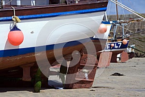 Boat Rudders at Low Tide