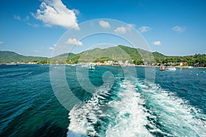 The boat run off the island,  will see the mountains and sky as the view during go to another island