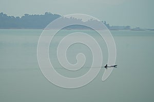 A Boat Running in the Nam Ngum Reservoir in Vientiane Province, Laos.