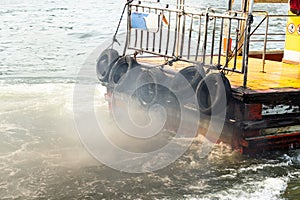 Boat`s fumes emissions in the river