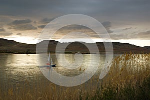 Boat, sail and clouds