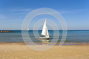 Boat with sail on a sunny day