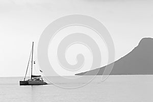 A boat sailing along the coast of Lefkada, Ionian Sea,  Greece.