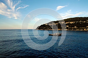 Boat sailing along the Italian coasts photo