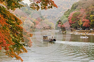 Boat sailing along Katsura river in Arashiyama, Kyoto city in Japan