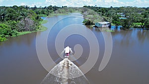 Boat sailing at Amazon River at Amazon Rainforest. Manaus Brazil.