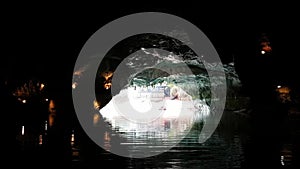 The boat is sailing during the excursion through the cave, Altinbasak in Turkey. Cave lake with beautiful lighting