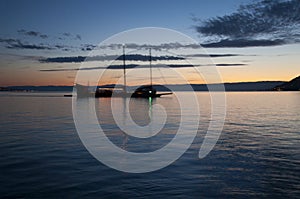 A Boat Sailing in Lake Geneva at Sunset
