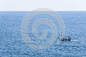 Boat sailing in the Mediterranean Sea in Catalonia, Spain