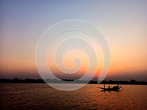 Boat sailing in river ganga sunset view