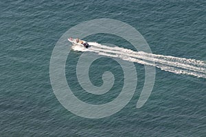 Boat sailing the sea at high speed. Rimini Italy