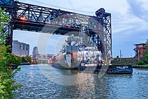 Boat sailing under drawbridge in Cleveland