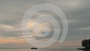 Boat sailing on water. One Swiss excursion ship sailing on lake Geneva. Port, sky, clouds and mountains.