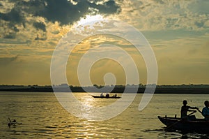 boat sailors at sunrise sunset