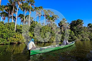 Boat on the Sandoval lake. Puerto Maldonado, Peru photo