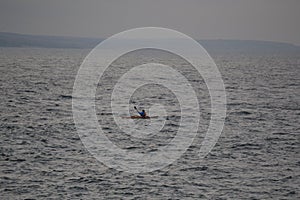 Boat in the sea drives towards the pier